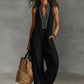 Női ujjatlan, V-nyakú, széles szárú jumpsuit