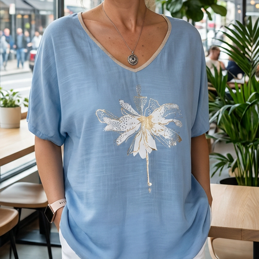 Damska bluzka z dekoltem w serek i kwiatowym nadrukiem