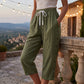 Damowe spodnie capri w stylu casualowym z guzikami po bokach